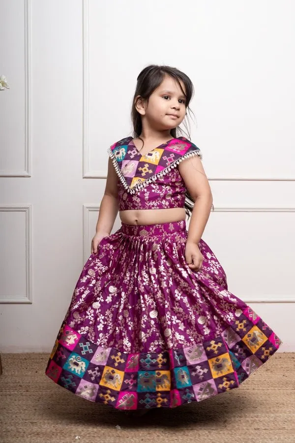 Elegant purple lehenga set with intricate golden floral motifs and multicolored patchwork accents for a festive look